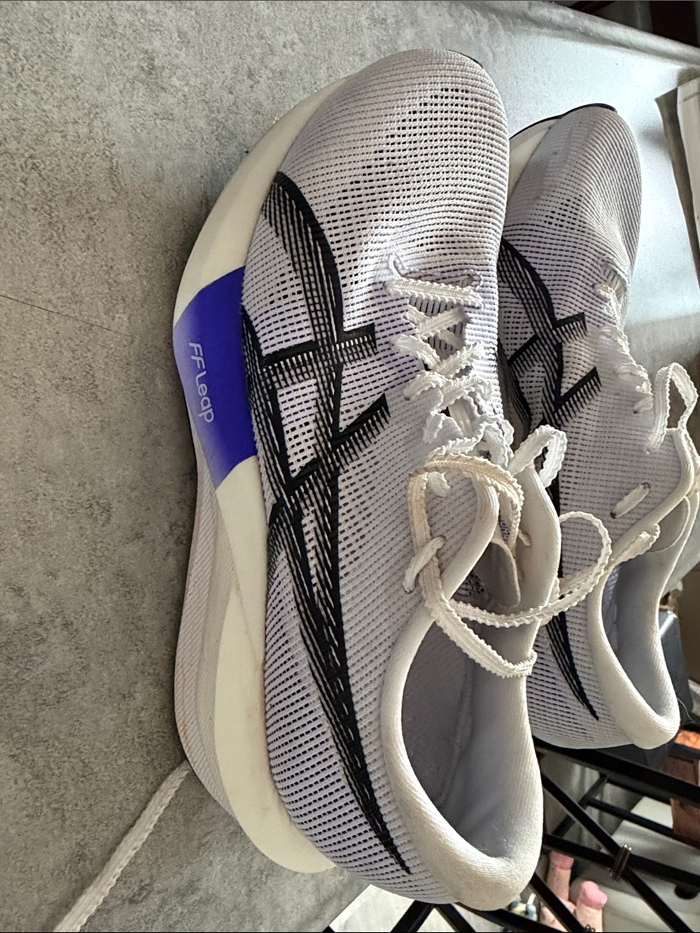 ASICS Magic Speed women’s  with Black Logos and Purple Midsole Accent